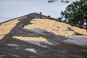 roof damage after a storm in Raymore, MO