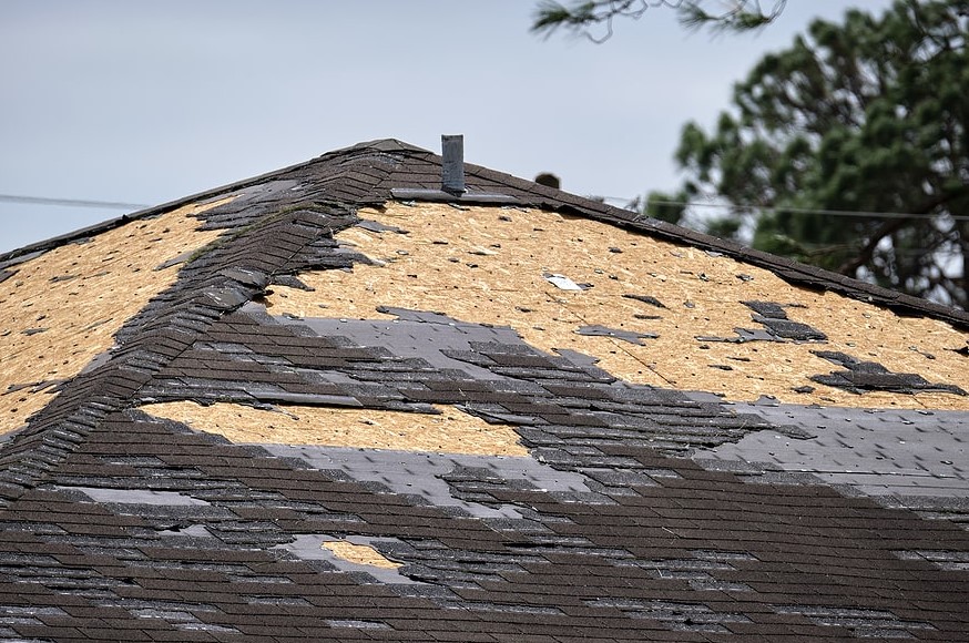 roof damage after a storm in Raymore, MO